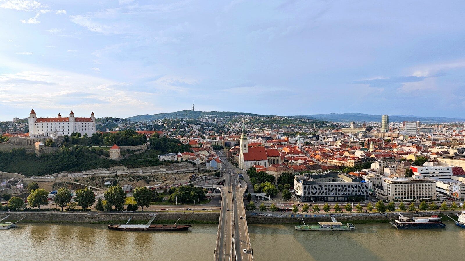 a view of a city with a bridge over a river